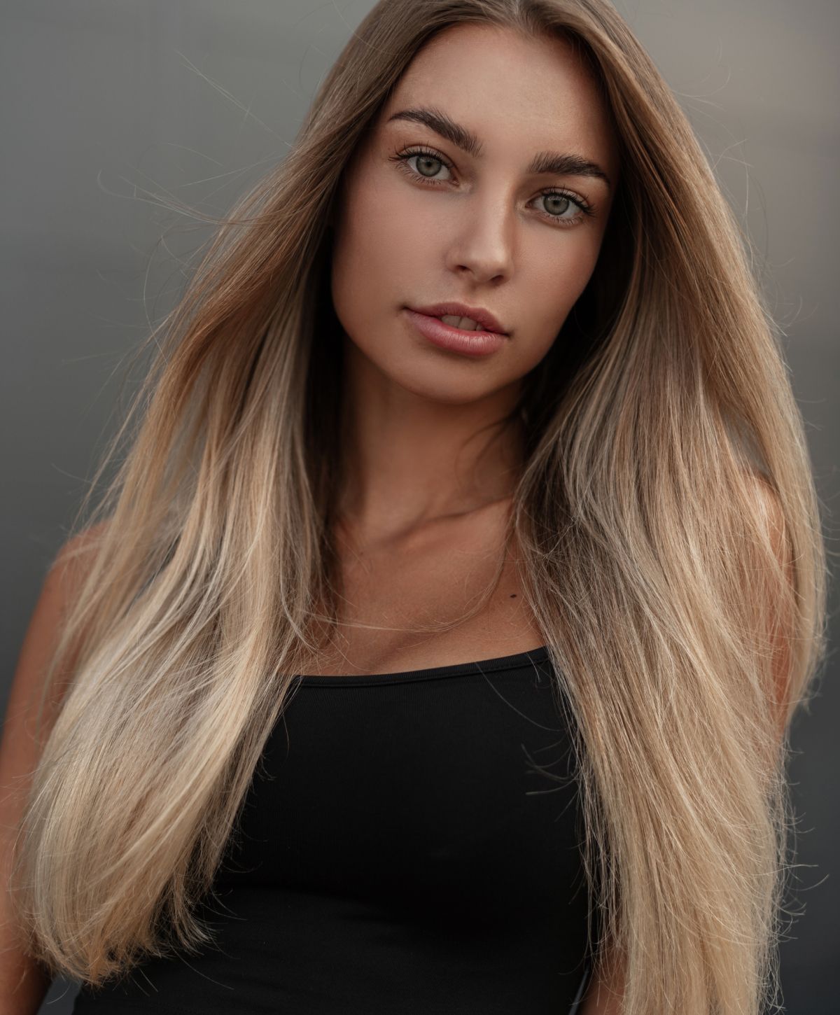 Portrait of a woman with long, flowing hair.