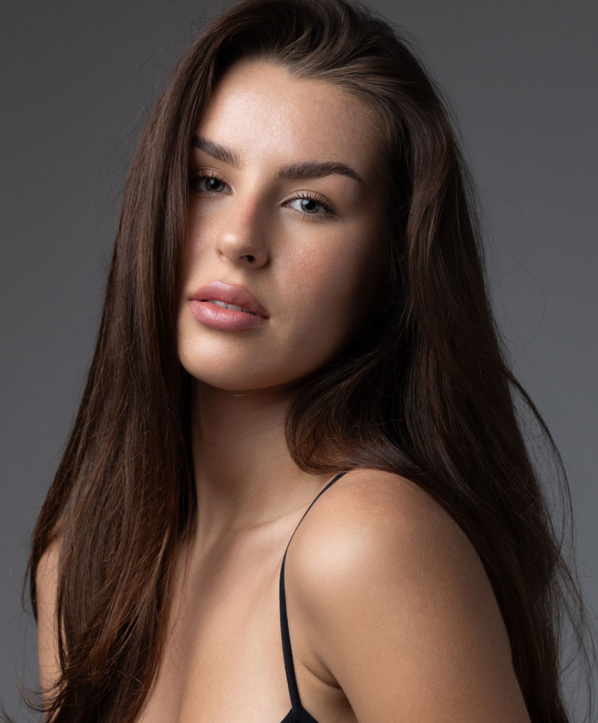 Close-up portrait of a woman with long hair.
