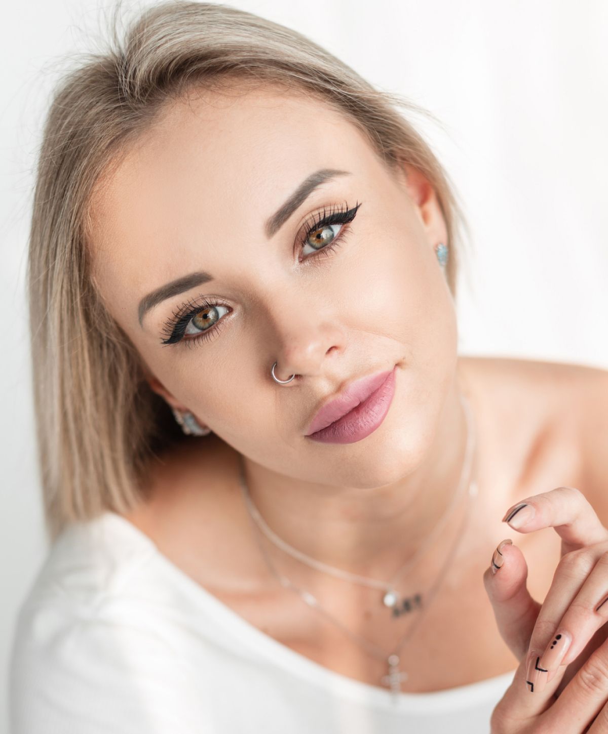 Smiling woman with long, dark hair.