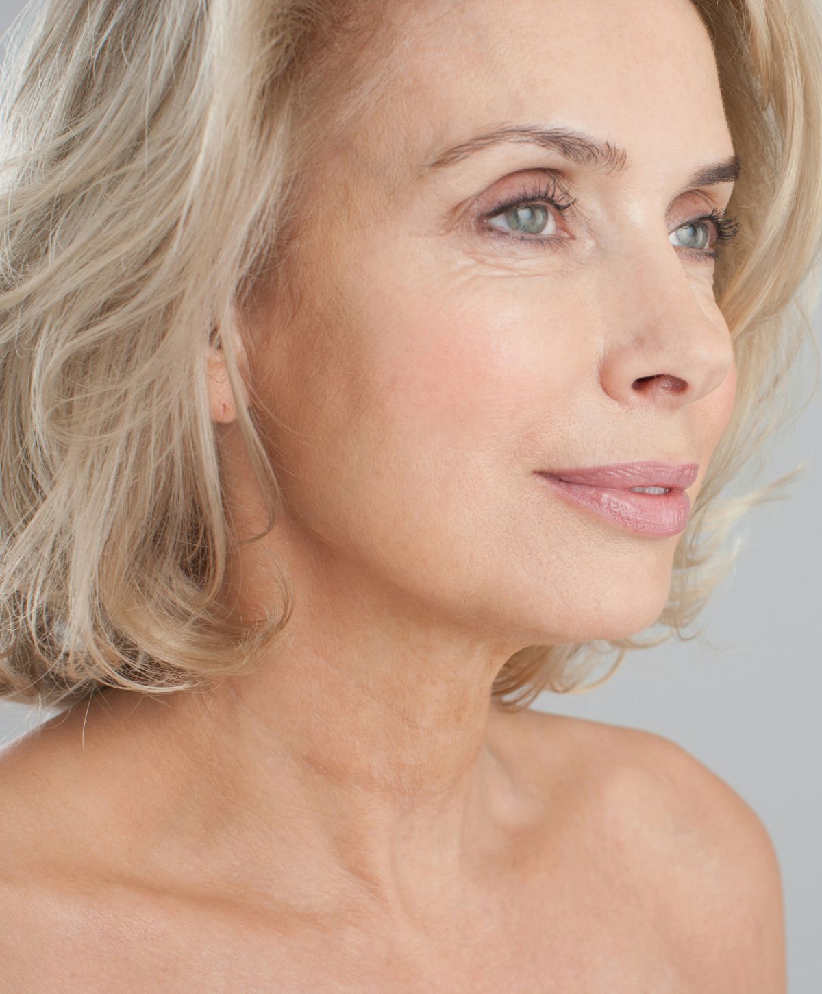 Profile of a mature woman with blonde hair.